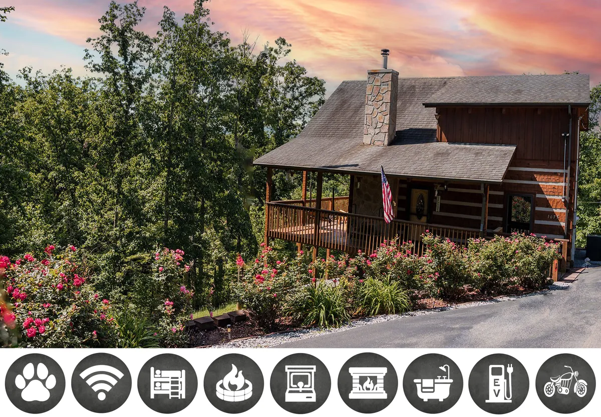 The hero image showcases a classic log cabin nestled among flowering shrubs, with a welcoming front porch and an American flag fluttering in the breeze. The stone chimney hints at a cozy fireplace inside, while the lush greenery and woods in the background promise peaceful seclusion. The scene feels inviting, comfortable, and restful, perfect for relaxing after a day of adventure.